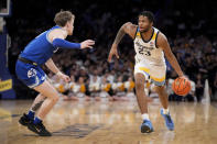 Marquette's David Joplin (23) drives against Xavier's Adam Kunkel, left, in the first half of an NCAA college basketball game for the championship of the Big East men's tournament, Saturday, March 11, 2023, in New York. (AP Photo/John Minchillo)