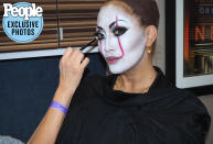 <p>"Carrie Ann gave Pennywise a glamorous twist," says makeup artist <a href="https://www.instagram.com/marylinmakeup/" rel="nofollow noopener" target="_blank" data-ylk="slk:Marylin Lee Spiegel;elm:context_link;itc:0;sec:content-canvas" class="link ">Marylin Lee Spiegel</a>. "I used <a href="https://www.mehron.com/clown-white/" rel="nofollow noopener" target="_blank" data-ylk="slk:Mehron Clown White Cream makeup;elm:context_link;itc:0;sec:content-canvas" class="link ">Mehron Clown White Cream makeup</a> for her skin, <a href="https://inglotcosmetics.com/eyes/eyeliner" rel="nofollow noopener" target="_blank" data-ylk="slk:Inglot black cream eyeliner;elm:context_link;itc:0;sec:content-canvas" class="link ">Inglot black cream eyeliner</a> for her smokey eye and eyebrows, then used <a href="https://www.nyxcosmetics.com/eye/eyeliner/vivid-brights-liner/NYX_326.html?dwvar_NYX__326_color=Vivid%20Fire" rel="nofollow noopener" target="_blank" data-ylk="slk:NYX Vivid Brights Eyeliner in Vivid Fire;elm:context_link;itc:0;sec:content-canvas" class="link ">NYX Vivid Brights Eyeliner in Vivid Fire</a> to create the signature Pennywise lines that go up the face."</p>