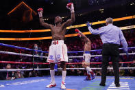 Manny Pacquiao, right, of the Philippines, and Yordenis Ugas, of Cuba, celebrate after their welterweight championship boxing match Saturday, Aug. 21, 2021, in Las Vegas. Ugas won by unanimous decision (AP Photo/John Locher)