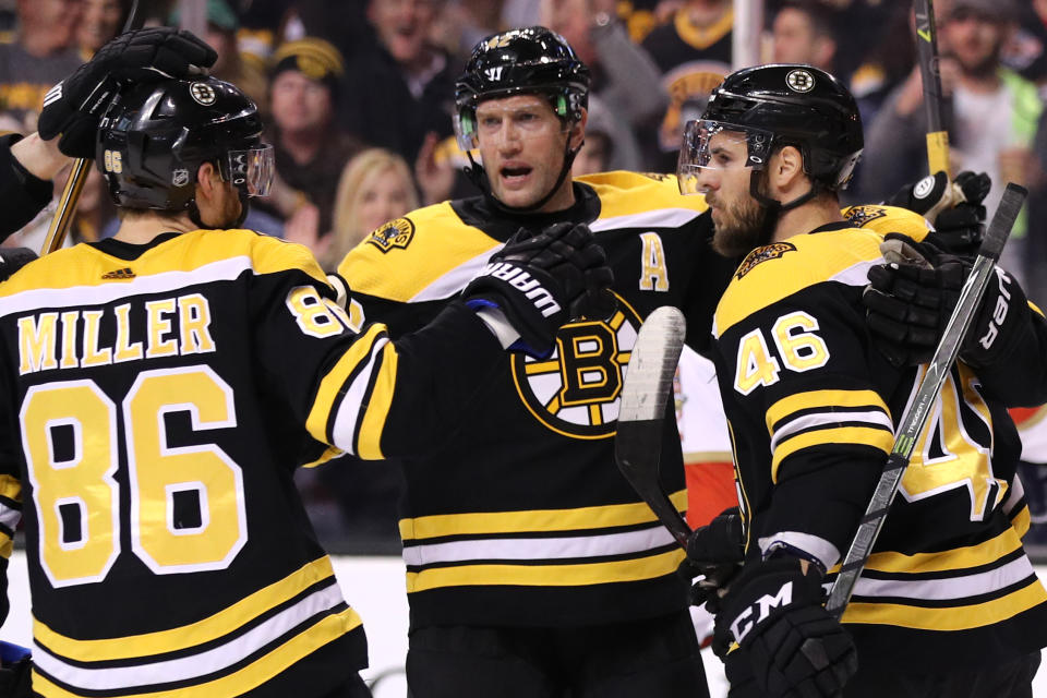 BOSTON, MA - APRIL 08: David Backes #42 of the Boston Bruins, center, celebrates with Kevan Miller #86 and David Krejci #46 after scoring against the Florida Panthers during the first period at TD Garden on April 8, 2018 in Boston, Massachusetts. (Photo by Maddie Meyer/Getty Images)