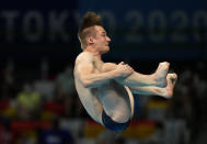 Jack Laugher of Britain competes in men's diving 3m springboard final at the Tokyo Aquatics Centre at the 2020 Summer Olympics, Tuesday, Aug. 3, 2021, in Tokyo, Japan. (AP Photo/Dmitri Lovetsky)