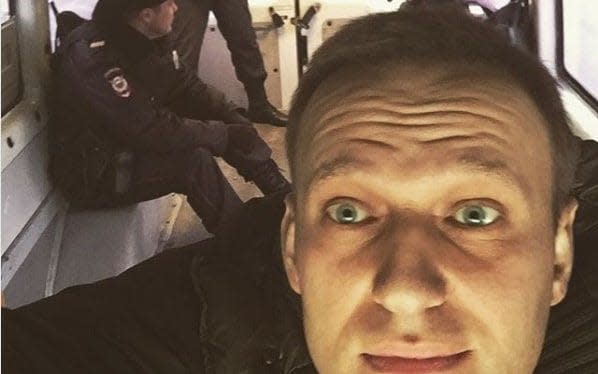 Alexei Navalny posted a picture of himself in a van with police after he was detained - Alexei Navalny/Instagram