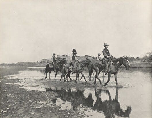 Erwin E. Smith (1886-1947); Turkey Track Cowboys Crossing the Wichita River, Turkey Track Ranch, Texas; 1906; Gelatin silver print.