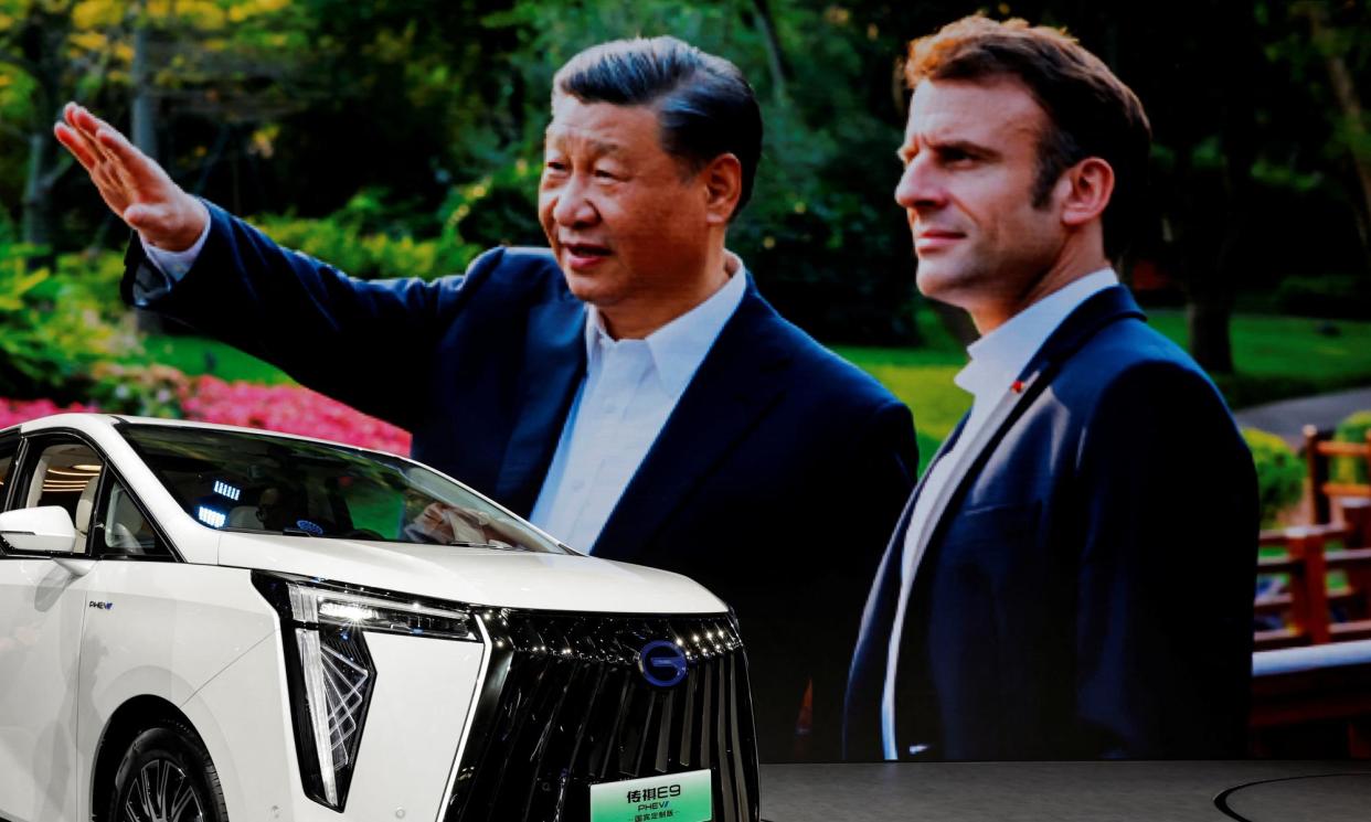 <span>An image of Xi Jinping with Emmanuel Macron displayed at the Auto China show in Beijing last month highlights that tariffs on importing Chinese electric vehicle into Europe may be discussed when they meet again next week. </span><span>Photograph: Tingshu Wang/Reuters</span>