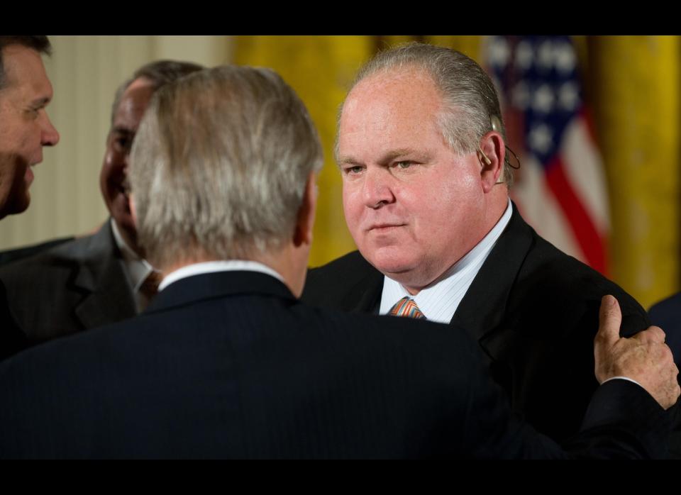 Radio talk show host Rush Limbaugh speaks with guests prior to a ceremony where US President George W. Bush presented former British Prime Minister Tony Blair, Australia's former Prime Minister John Howard and Colombian President Alvaro Uribe with the Presidential Medal of Freedom in the East Room of the White House in Washington, DC, January 13, 2009. AFP PHOTO / Saul LOEB (Photo credit should read SAUL LOEB/AFP/Getty Images)