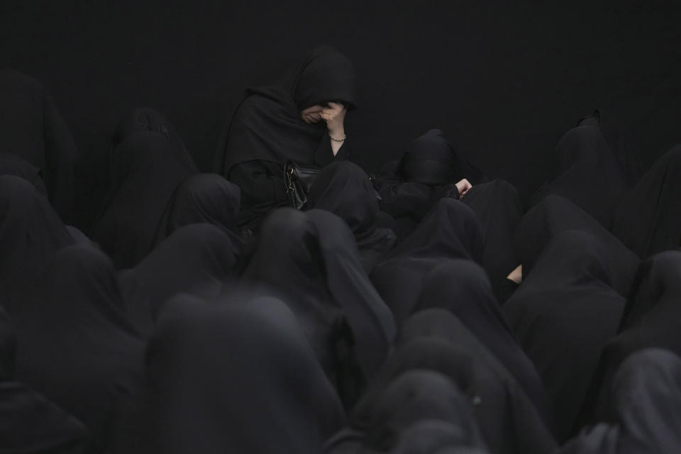 Women attend the Ashoura mourning ritual, Friday, July 28, 2023, in Tehran, Iran. Millions of Shiite Muslims around the world on Friday commemorated Ashoura, a remembrance of the 7th-century martyrdom of the Prophet Muhammad's grandson, Hussein, that gave birth to their faith. (AP Photo/Vahid Salemi)