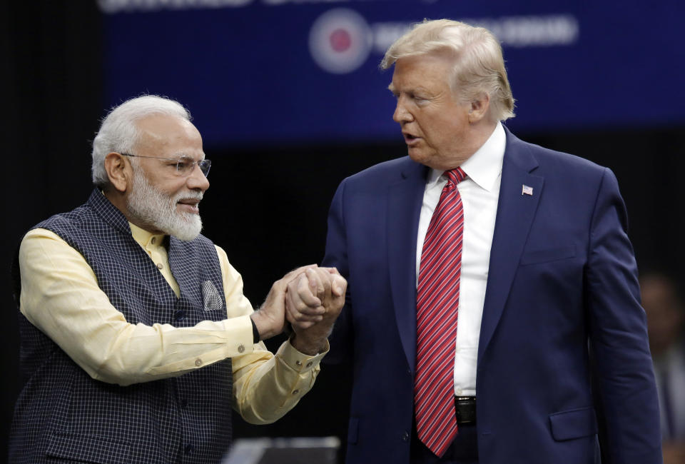 Prime Minister Narendra Modi and President Donald Trump shake hands after introductions during the "Howdi Modi" event Sunday, Sept. 22, 2019, at NRG Stadium in Houston. (AP Photo/Michael Wyke)