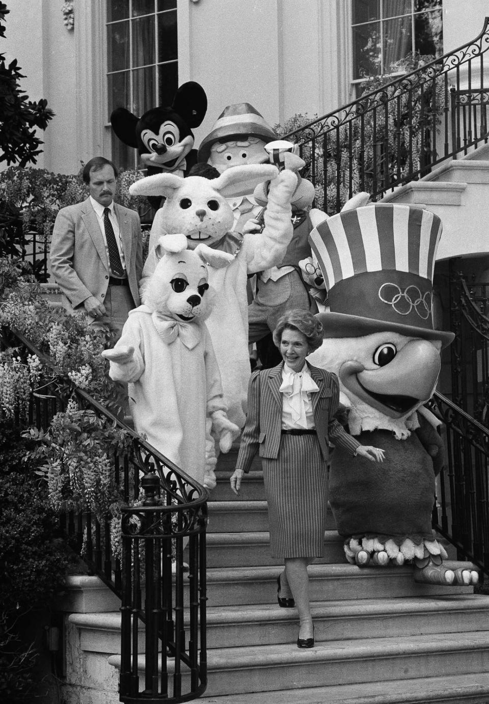 Nancy Reagan walks down White house steps with Easter characters