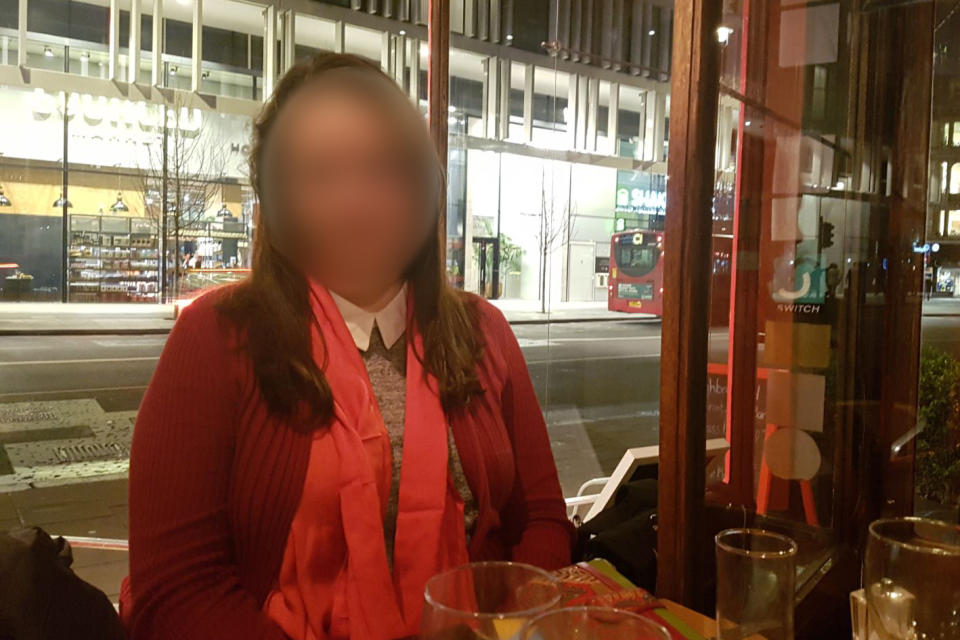 Alison Weyland with a blurred face sitting in restaurant