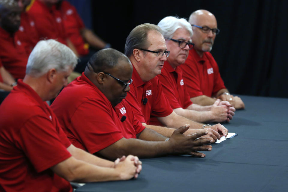 United Auto Workers President Gary Jones, third from left, opens contract talks with the Ford Motor Co., Monday, July 15, 2019, in Dearborn, Mich. (AP Photo/Carlos Osorio)