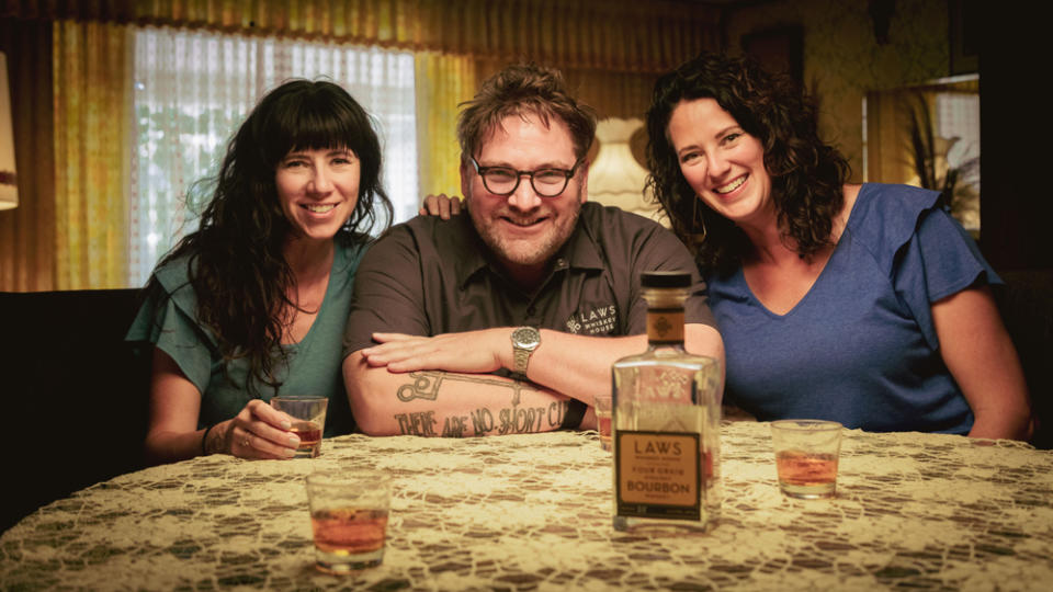 The Ohnmacht sisters with the founder of Laws Whiskey House