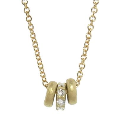 Buy&nbsp;Tate's&nbsp;<a href="https://www.ylang23.com/product/tiny+donut+triplet+necklace+with+diamonds.do?gclid=CIOU7O-_1NQCFZlMDQodqCMDDA" target="_blank">'tiny donut necklace with diamonds'</a>