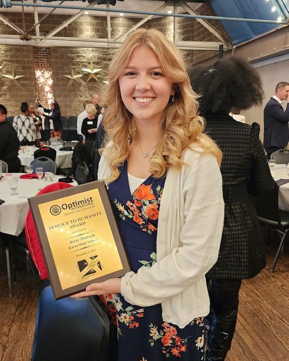 Avery Hanson accepts the Optimist International club of Knoxville’s Service to Humanity award at the Foundry, Dec. 1, 2023.