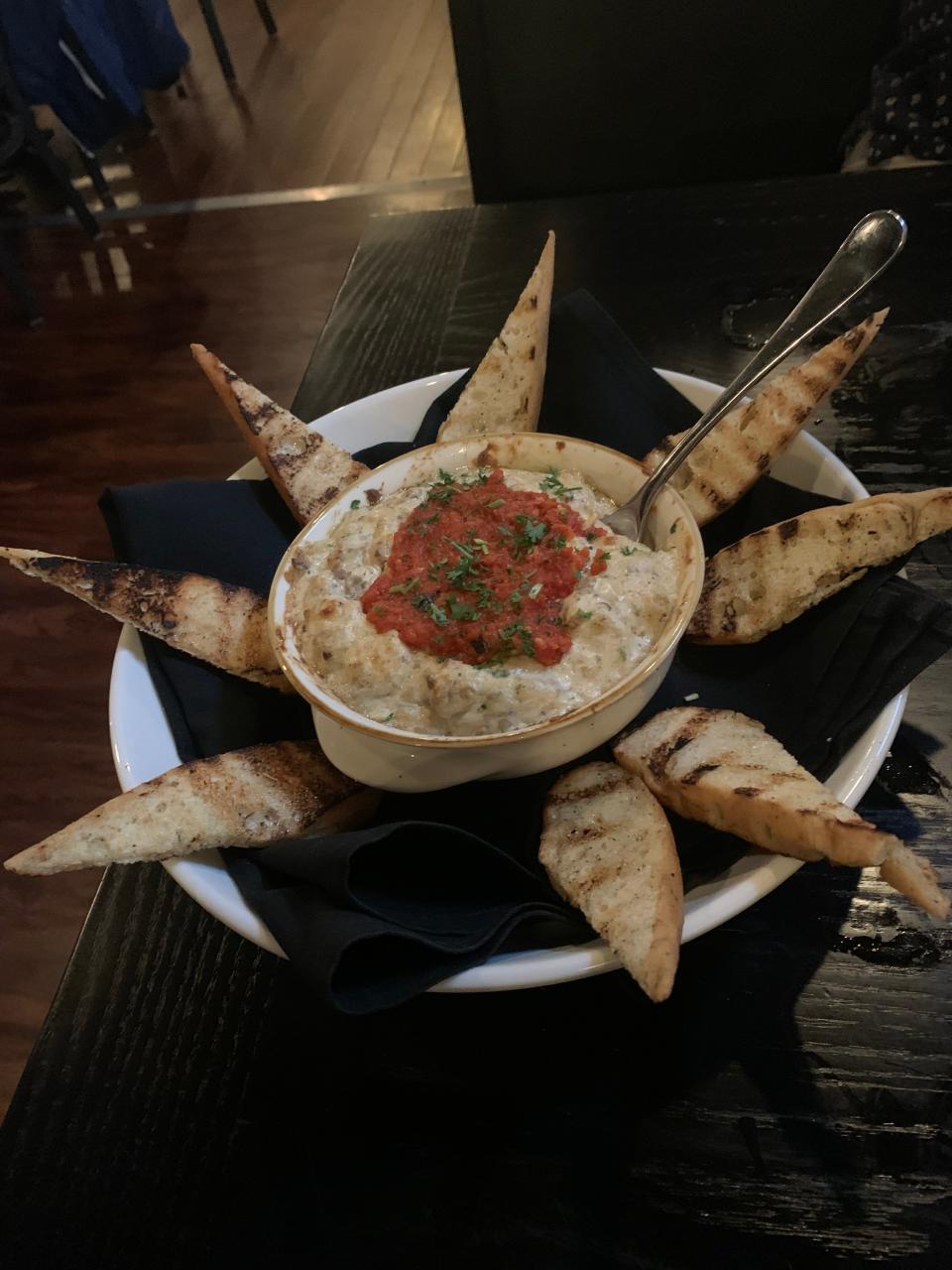 The roasted banana pepper dip is the most popular appetizer at Divine in Cuyahoga Falls.