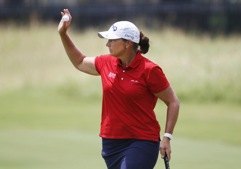 Angela Stanford waves to the gallery after making a birdie on the second hole during the final round of the LPGA Volunteers of America Classic golf tournament in The Colony, Texas, Sunday, July 4, 2021. (AP Photo/Ray Carlin)
