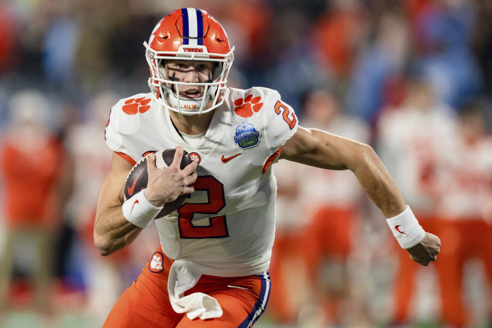 Clemson quarterback Cade Klubnik runs with the ball in the first half during the Atlantic Coast Conference championship NCAA college football game against North Carolina on Saturday, Dec. 3, 2022, in Charlotte, N.C. (AP Photo/Jacob Kupferman)