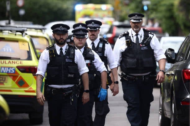 Police officers patrol following a car collision at the private Study Prep girls’ school in Wimbledon, southwest London, on 6 July 2023 (AFP via Getty Images)