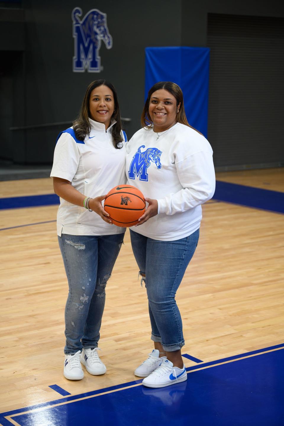 Memphis women's basketball coach Katrina Merriweather (left) hired her sister Kabrina Merriweather as an assistant coach with the Tigers.