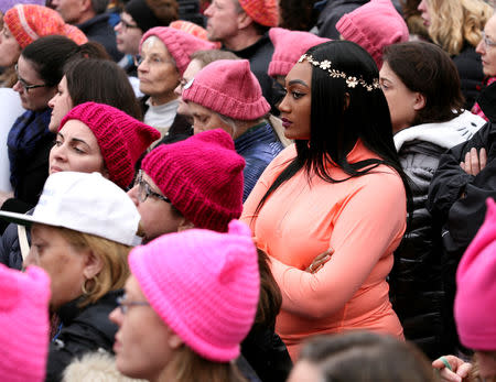 FILE PHOTO: People listen to speeches at the Women's March in opposition to the agenda and rhetoric of President Donald Trump Washington, DC, U.S., January 21, 2017. REUTERS/Canice Leung/File Photo