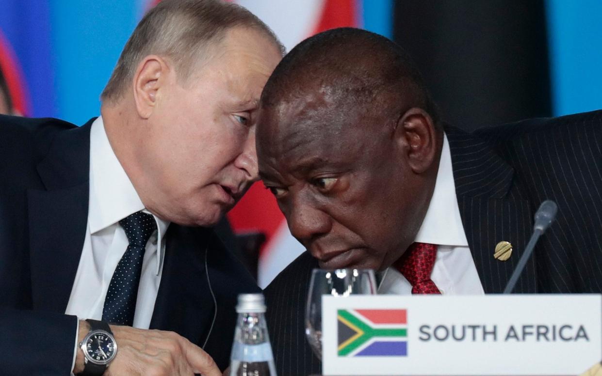 Putin speaks with Cyril Ramaphosa during a Russia-Africa summit in 2019 - Sergei Chirikov/AP