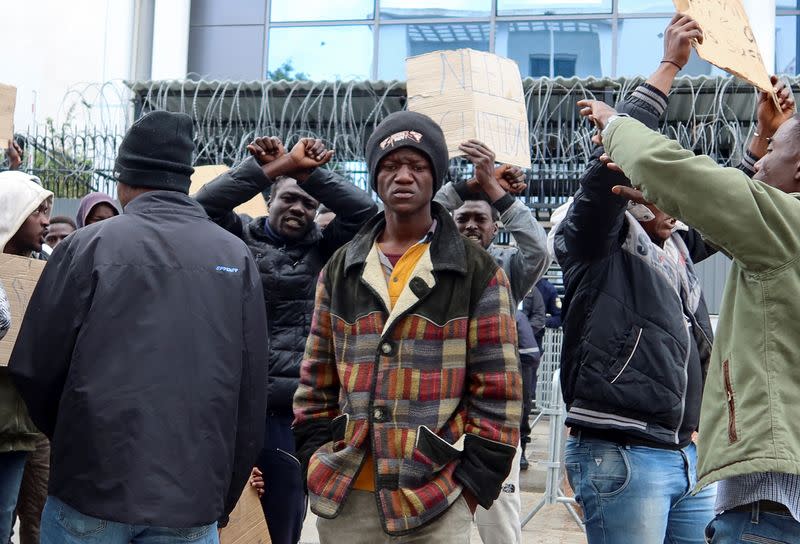 African migrant, Josephus Thomas, takes part in a protest in Tunis