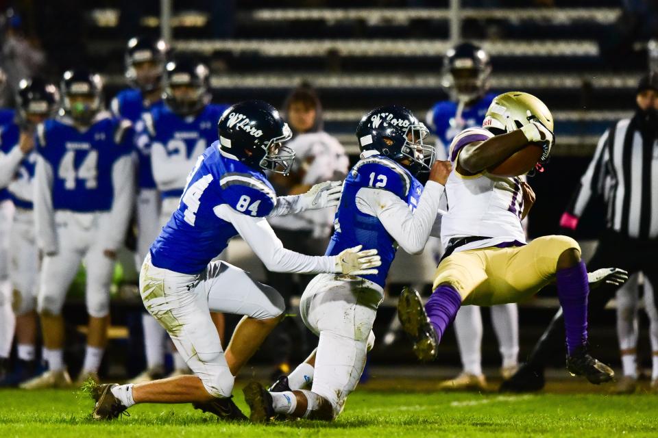 Whitesboro players Dashawn Hutchinson and Andrew Pawloski make a tackle during the Section III Class A first round playoff game against Christian Brothers Academy on Friday, Oct. 29, 2021. CBA won 20-12.