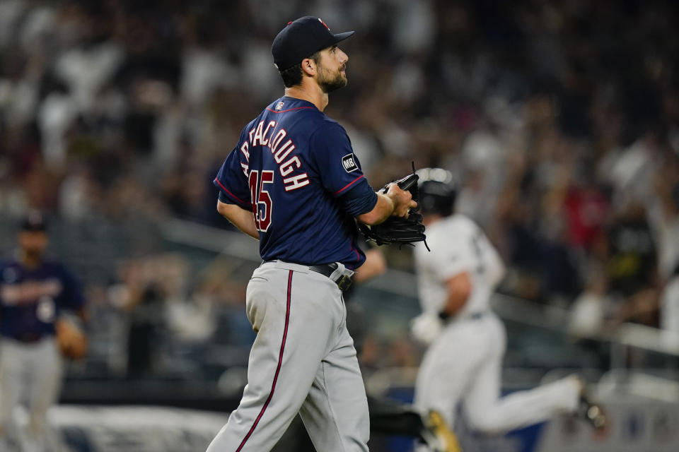 Minnesota Twins pitcher Kyle Barraclough reacts as New York Yankees' Luke Voit runs the bases after hitting a home run during the seventh inning of a baseball game Friday, Aug. 20, 2021, in New York. (AP Photo/Frank Franklin II)