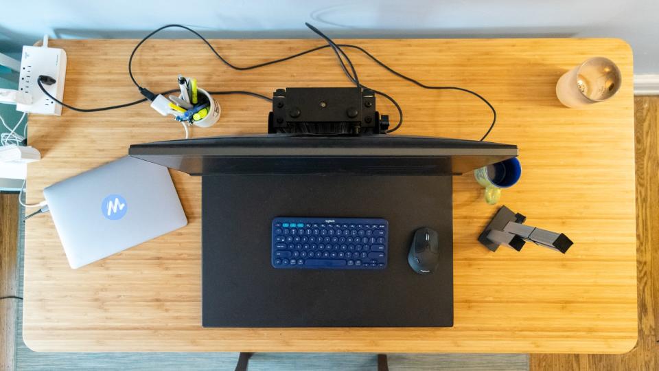 Standing desk converters