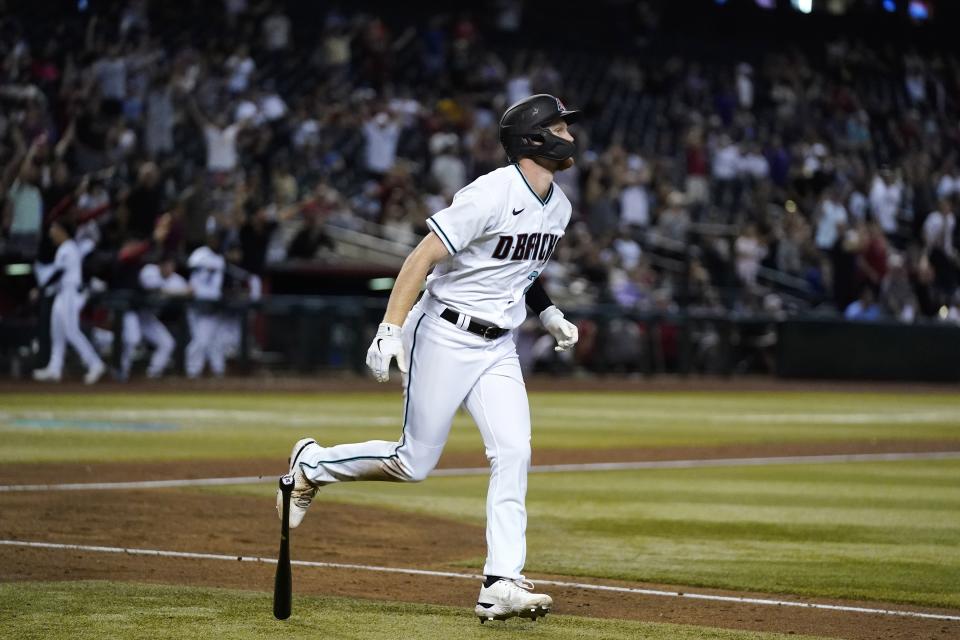 Arizona Diamondbacks' Pavin Smith watches his home run against the Kansas City Royals during the sixth inning of a baseball game Tuesday, May 24, 2022, in Phoenix. (AP Photo/Ross D. Franklin)