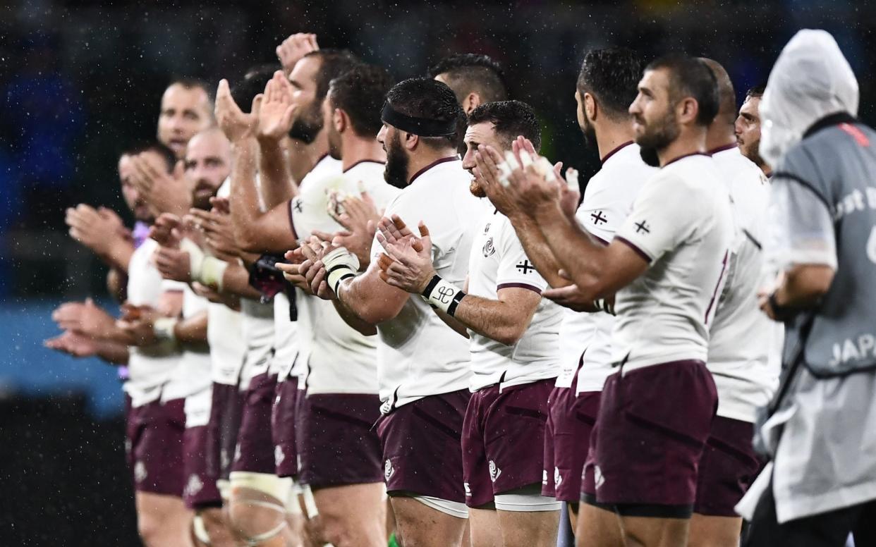file photo taken on October 11, 2019 shows Georgia's players acknowledging the crowd after the Japan 2019 Rugby World Cup Pool D match between Australia and Georgia at the Shizuoka Stadium Ecopa - Georgia's spot in Autumn Nations Cup secure despite vice president shooting a player in the leg - GETTY IMAGES