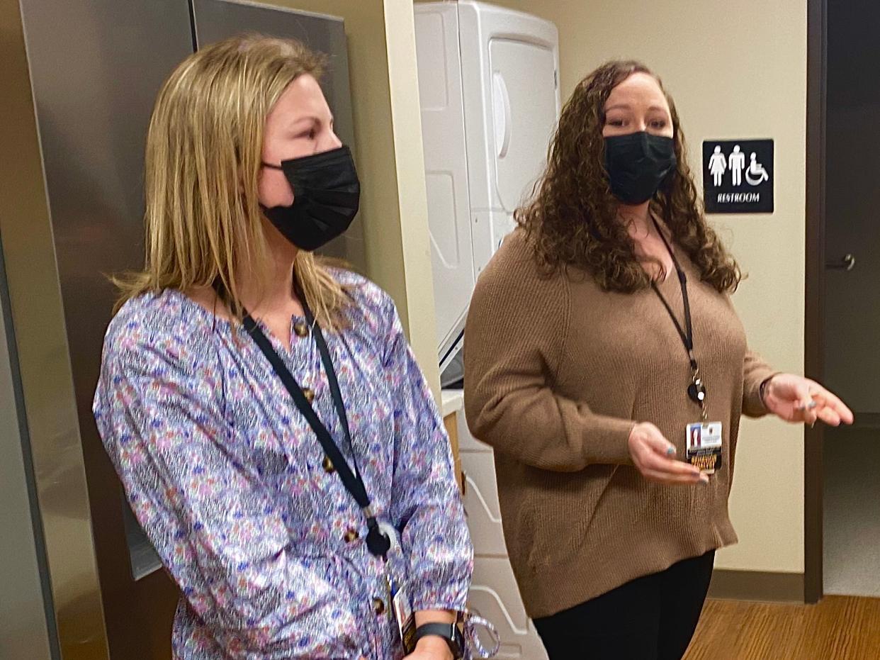 From left, Emma Keicher, clinical operations manager, and Brittany Schmitz, behavior analyst, with Thompson Center for Autism and Neurodevelopment on Thursday, Jan. 12, 2023, show off a life skills room for adolescents in the center's new therapy clinic.