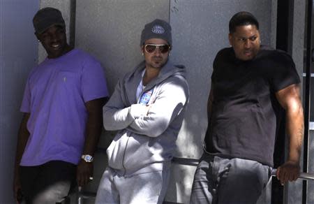 Pop singer Justin Bieber's father Jeremy Bieber (C) waits for his son's release from the Turner Guilford Knight Correctional Center in Miami, Florida January 23, 2014. REUTERS/Javier Galeano