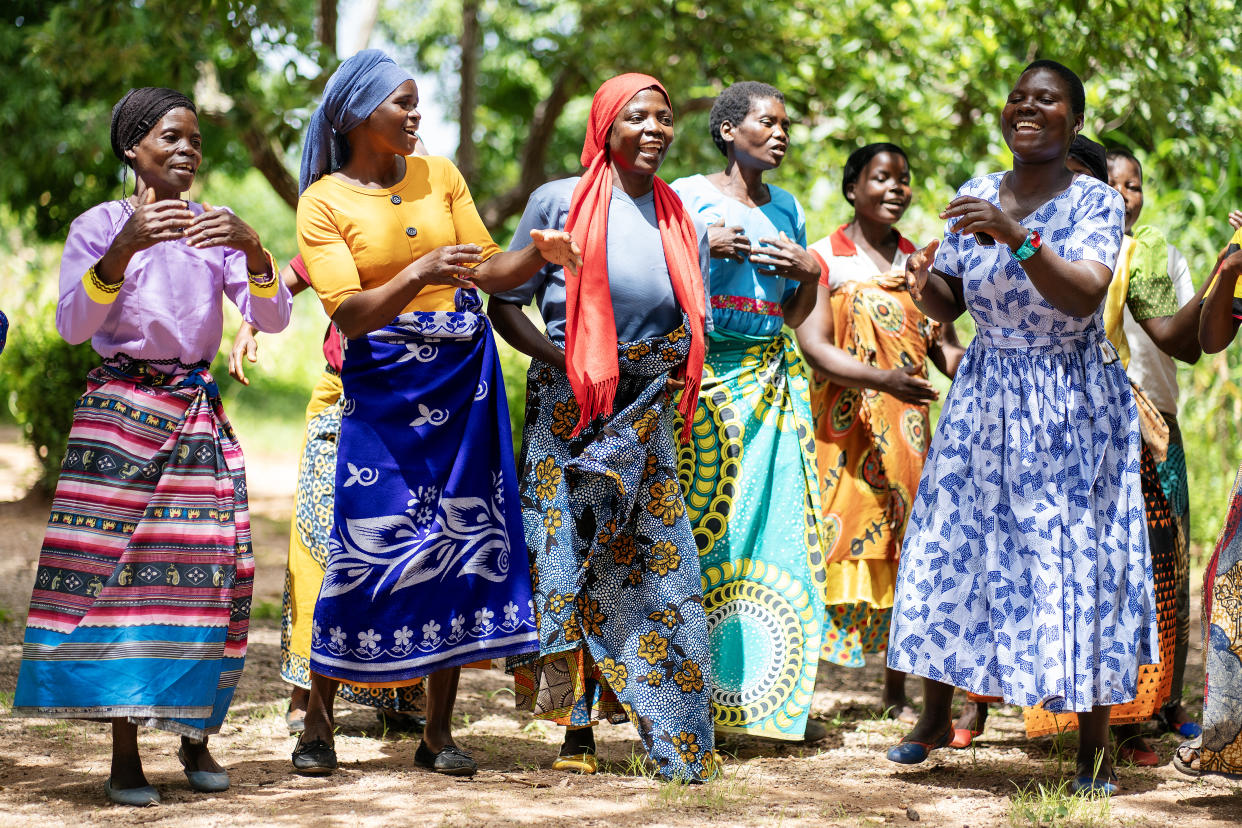 Women sing and dance in the village of Manduwasa in the Machinga region of Malawi (Brian Lawless/PA)