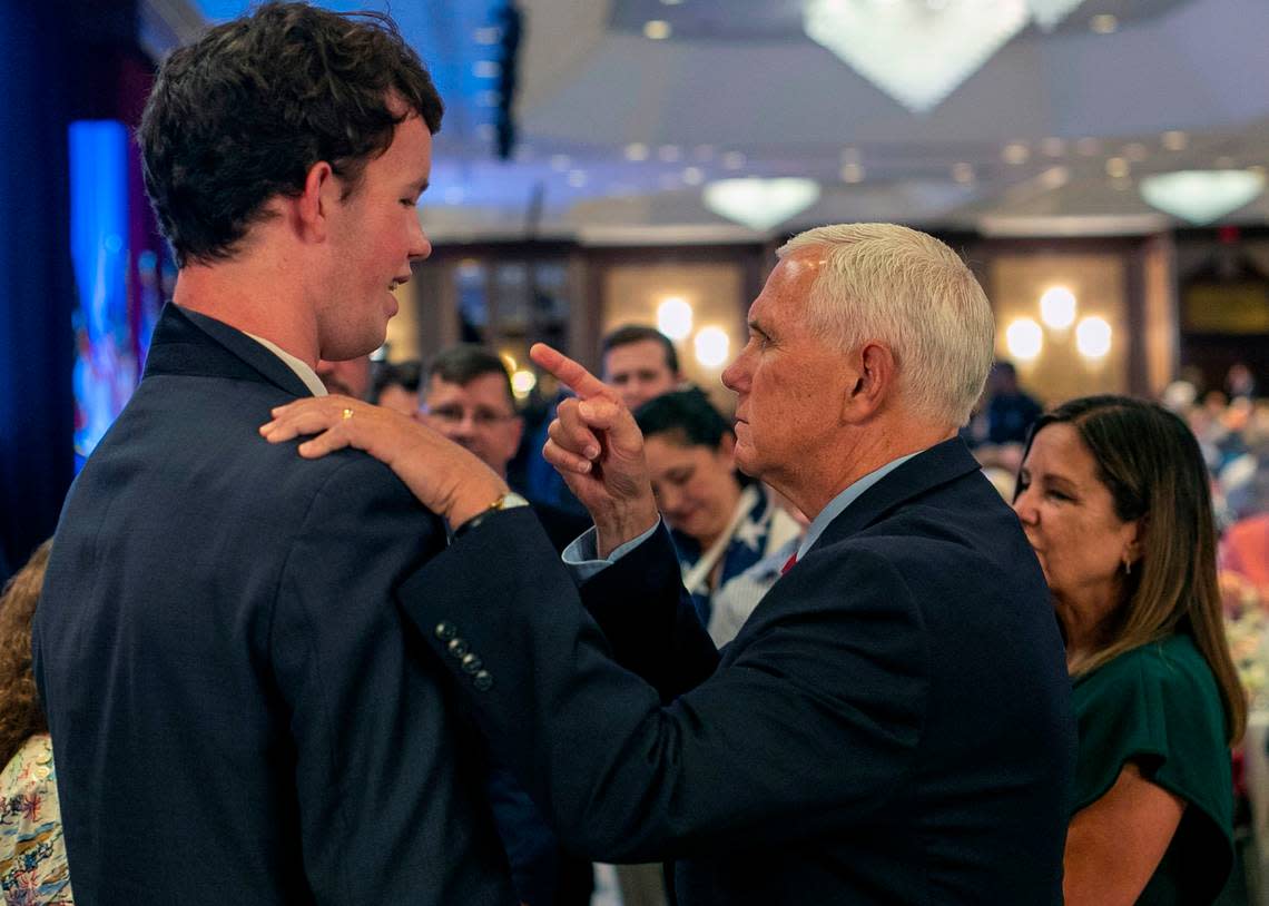 Former Vice President Mike Pence, a 2024 presidential candidate, talks with Dan Lancaster of Wayne County, prior to his address to the North Carolina Republican Party Convention at the Koury Convention Center on Saturday, June 10, 2023 in Greensboro, N.C. Robert Willett/rwillett@newsobserver.com