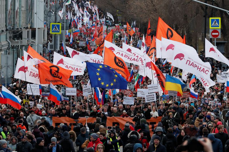 People take part in a rally to mark the 5th anniversary of Russian opposition politician Boris Nemtsov's murder and to protest against proposed amendments to the country's constitution, in Moscow