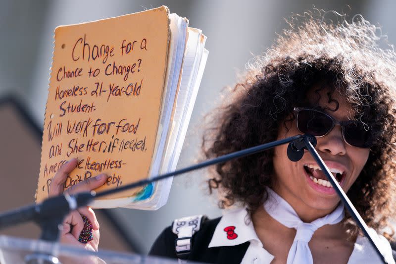 People protest as the U.S. Supreme Court reviews anti-camping laws that impact homeless, in Washington