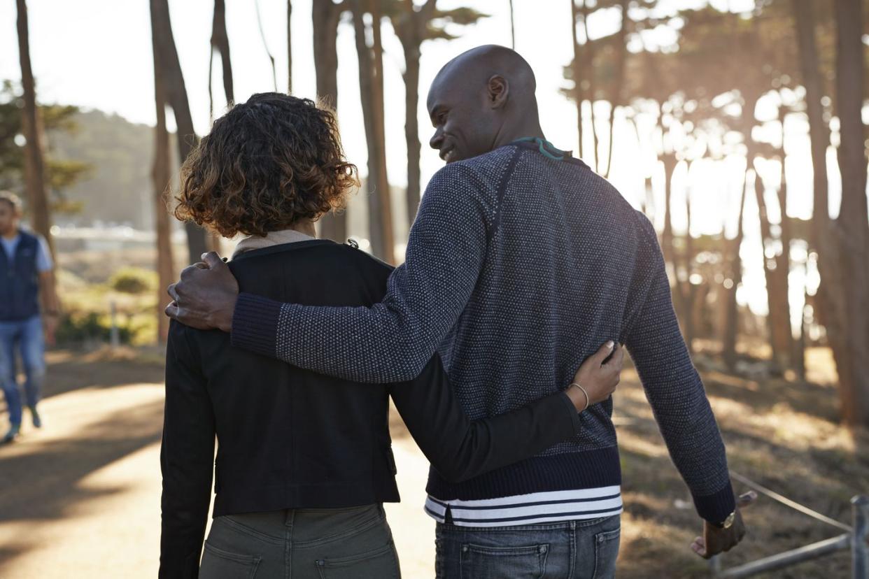 couple walking around in nature park