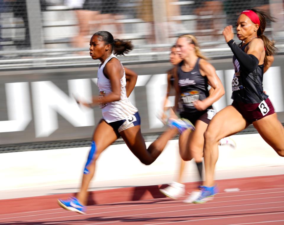 Desert Vista’s Rickaiya Whitman (L) and Hamilton’s Kori Martin (R) sprint down the track and to finish first and second respectively in the Division I Girls 100m Dash during the Arizona State Track and Field Championships at Red Mountain High School on Saturday, May 4, 2024.