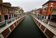 A canal flows through the center of the Florentia Village in the district of Wuqing, located on the outskirts of the city of Tianjin June 13, 2012. <br><br><a href="http://news.yahoo.com/photos/china-replicates-austrian-village-slideshow/" data-ylk="slk:Click here;elm:context_link;itc:0;sec:content-canvas;outcm:mb_qualified_link;_E:mb_qualified_link;ct:story;" class="link  yahoo-link">Click here</a> to see a related gallery: China replicates Austrian village