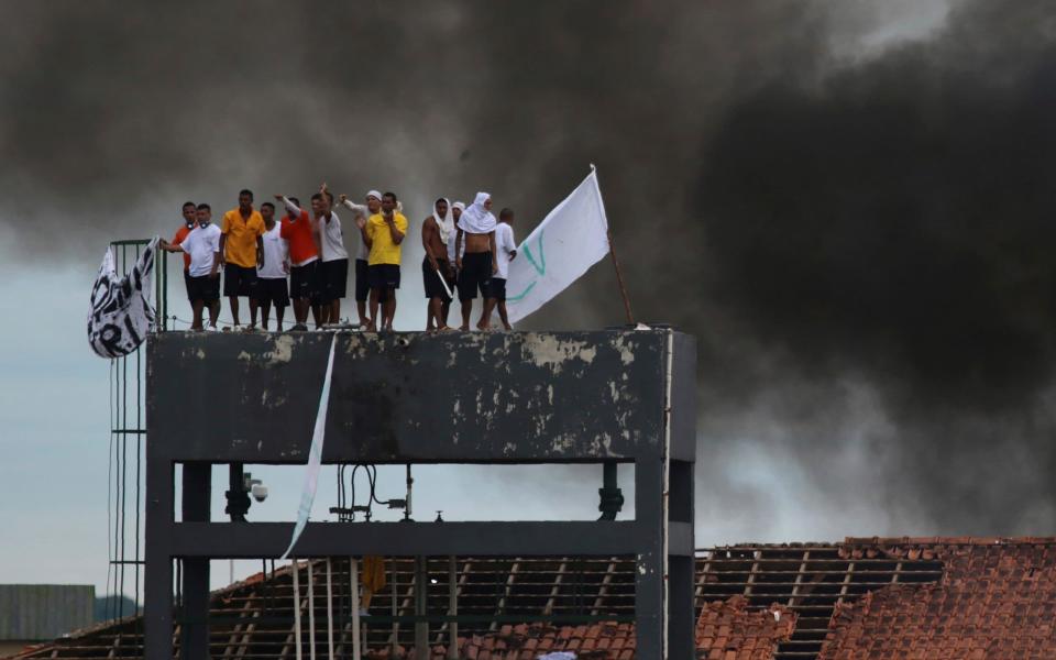 Inmates at the Puraquequara prison protest against restrictions put in place t curb the spread of the new coronavirus