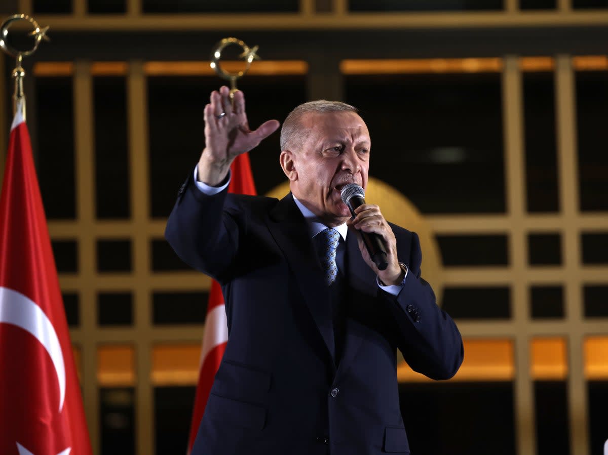 Erdogan addresses supporters outside his palace in Ankara on Sunday evening  (Getty)