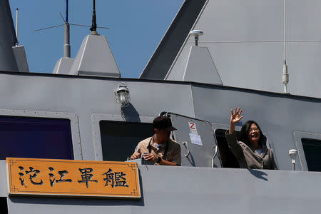 Taiwanese President Tsai Ing-wen waves her hand as she boards the nation's first domestically built stealth-missile 500-ton Tuo Jiang twin-hull corvette at Suao Naval Base in Yilan, Taiwan June 4, 2016. REUTERS/Tyrone Siu