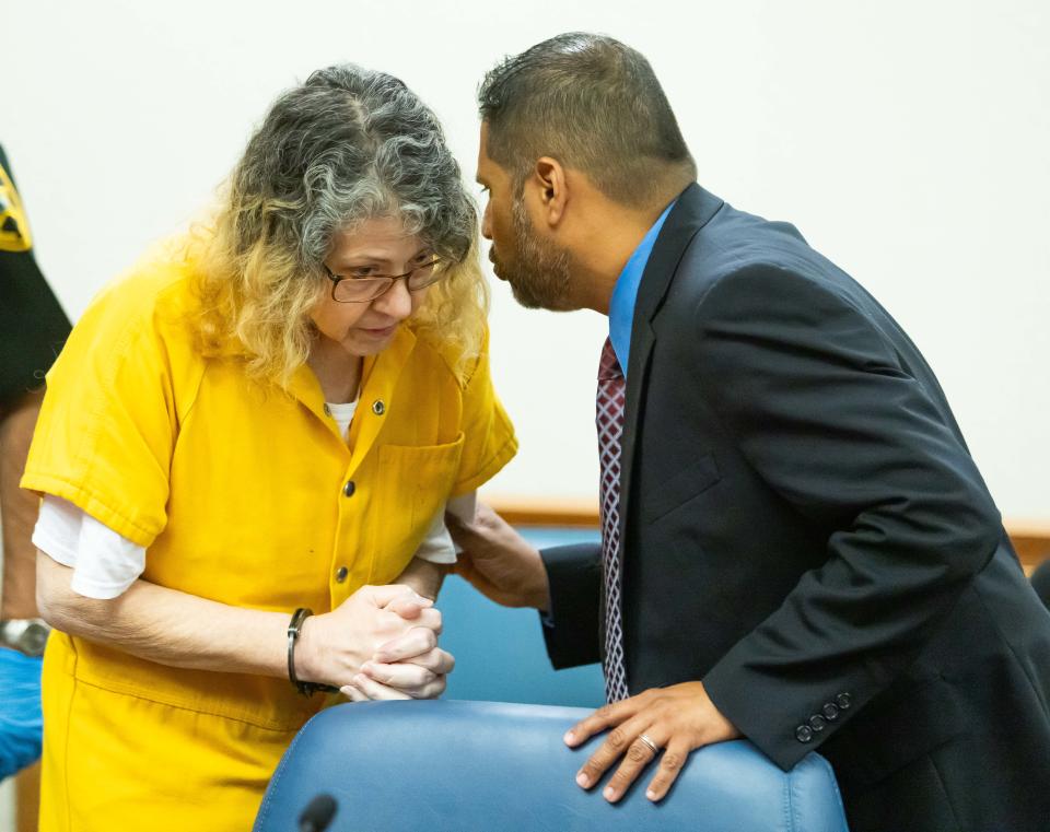 Susan Louis Lorincz speaks with one of her attorneys, Morris Carranza, during a continuance hearing Tuesday in Circuit Judge Robert Hodges’ courtroom.