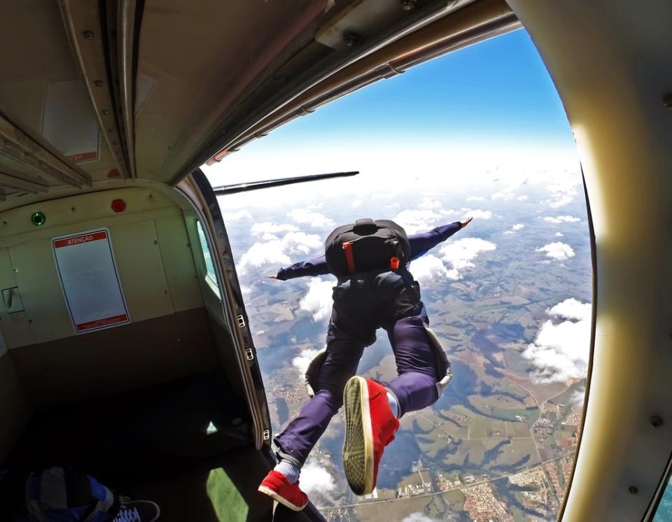 A person jumping out of an airplane.