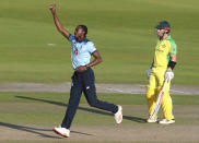 England's Jofra Archer celebrates the dismissal of Australia's David Warner during the second ODI cricket match between England and Australia, at Old Trafford in Manchester, England, Sunday, Sept. 13, 2020. (Martin Rickett/Pool via AP)