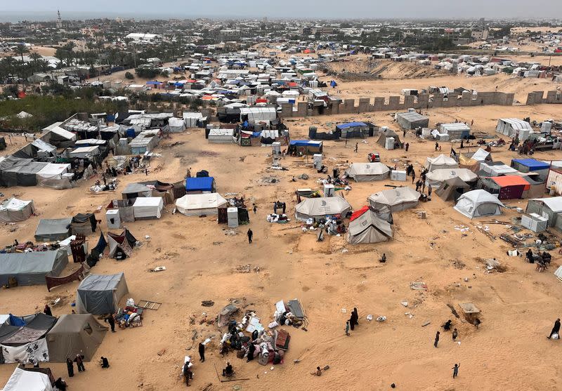 Displaced Palestinians shelter at a tent camp in Rafah