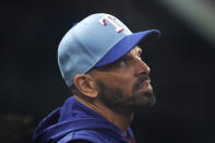 Texas Rangers manager Chris Woodward looks out from the dugout before the team's baseball game against the Seattle Mariners in Arlington, Texas, Aug. 14, 2022. The Rangers have fired Woodward with the team on pace for its sixth consecutive losing season. (AP Photo/LM Otero)