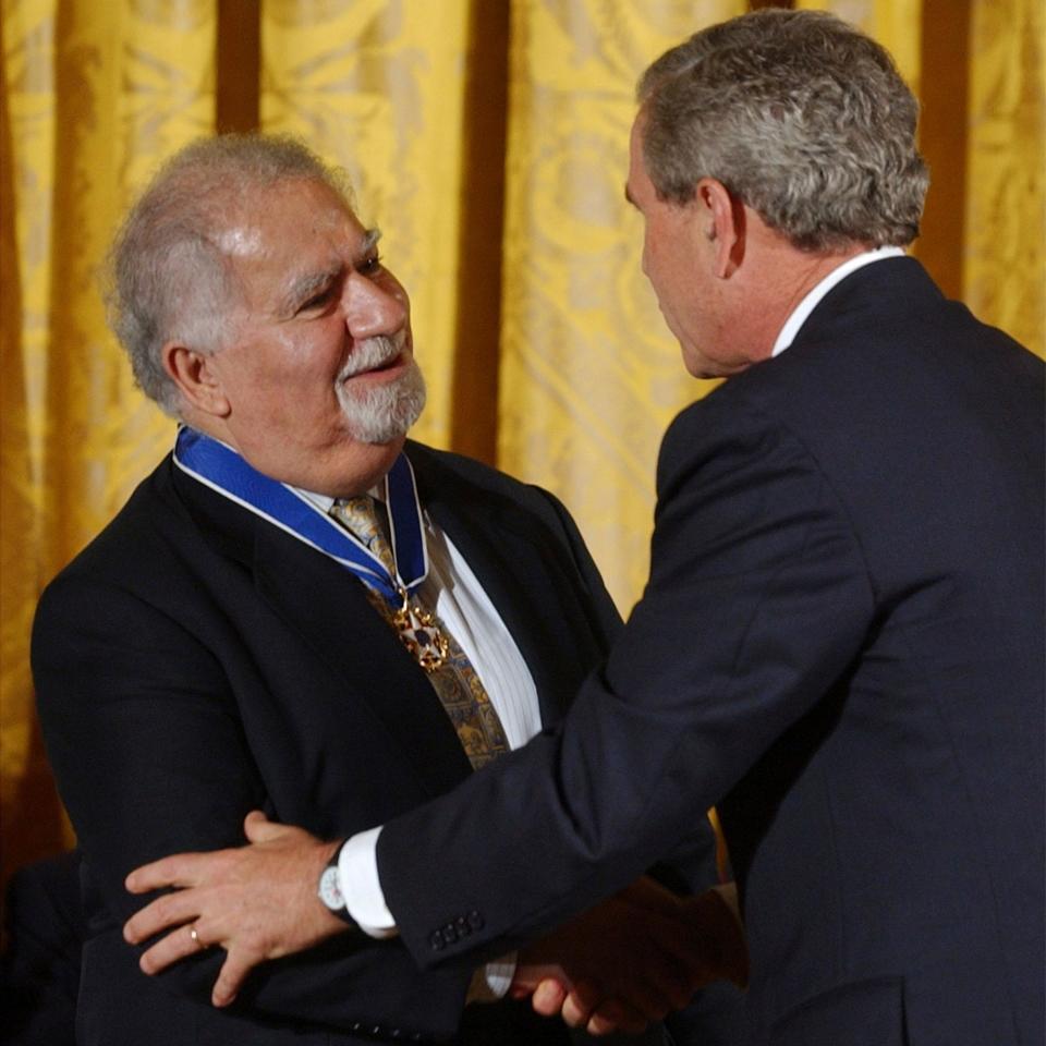 Receiving the Presidential Medal of Freedom from George W Bush in 2004 - Susan Walsh/AP