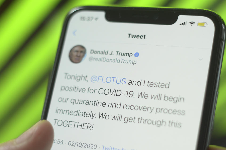 Pictured is a tweet by Donald Trump which says: Tonight,  @FLOTUS  and I tested positive for COVID-19. We will begin our quarantine and recovery process immediately. We will get through this TOGETHER!