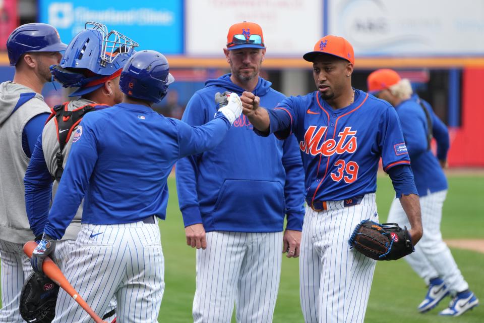 Feb 19, 2024; Port St. Lucie, FL, USA; New York Mets relief pitcher Edwin Diaz (39) greets shortstop Francisco Lindor, left, during workouts at spring training. Mandatory Credit: Jim Rassol-USA TODAY Sports